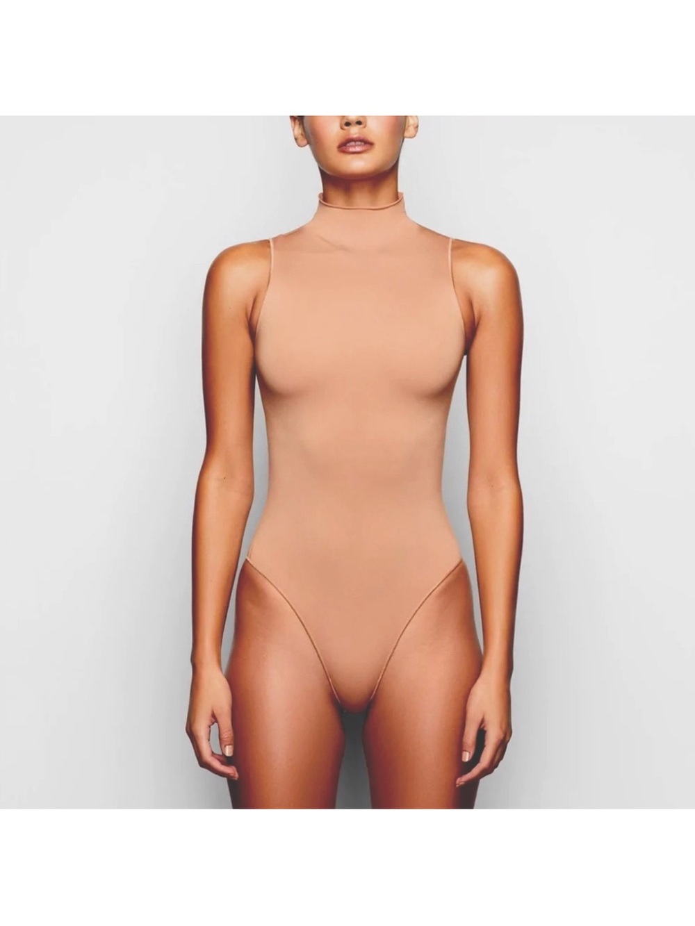 Sleeveless Mock Neck Bodysuit from Skims - Nude